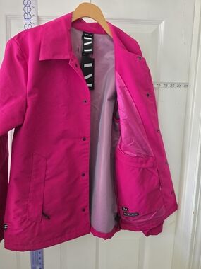 Seam Sealed Coach in Fuchsia by the brand The Very Warm.